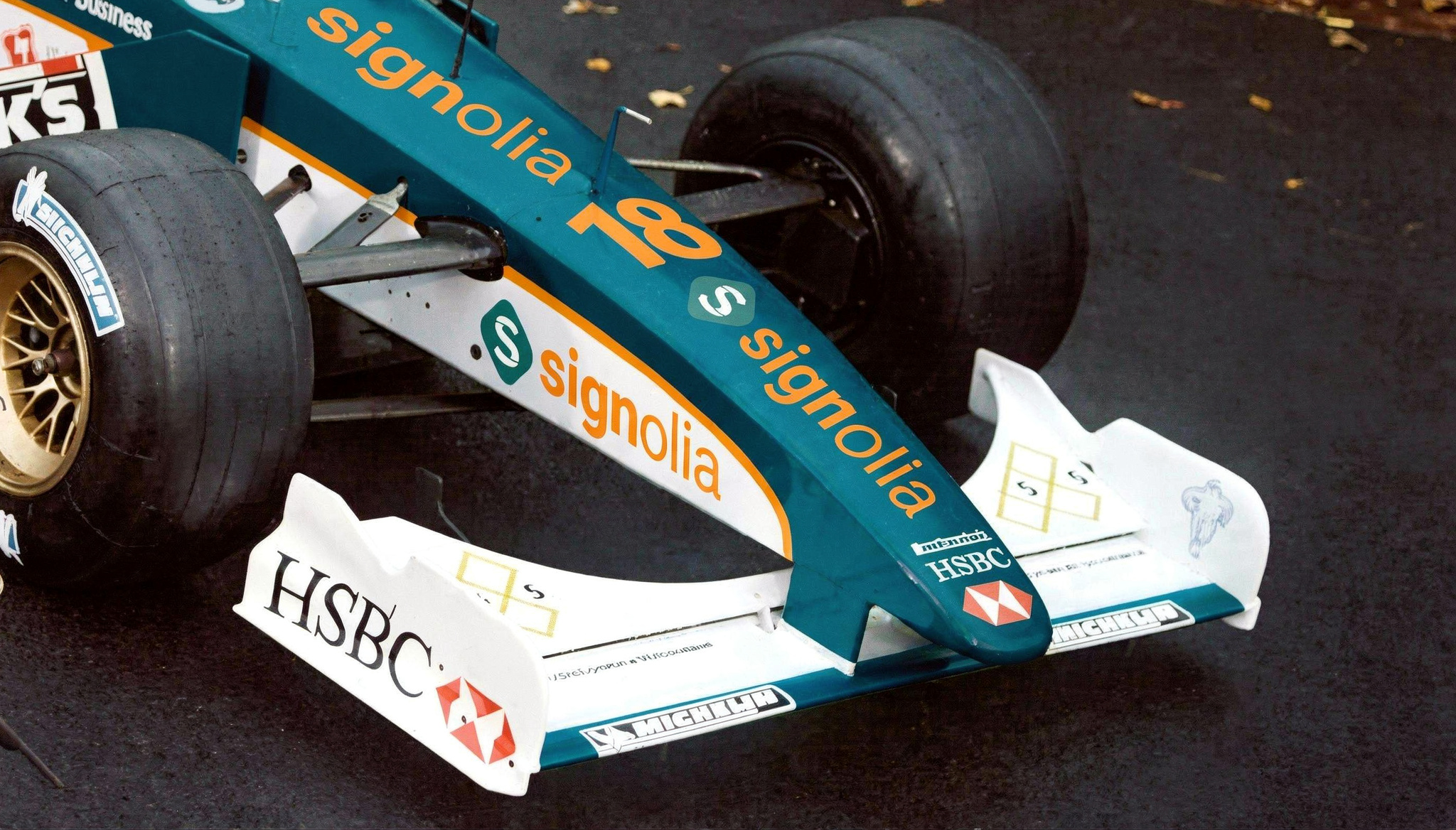 AI-generated image of a racing car with sponsor lettering and logos on the front wing and bodywork.